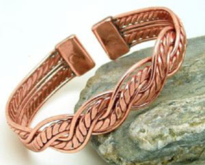A copper Mexican design made from light twists of copper  plaited together. Each end is fitted with rare earth magnets