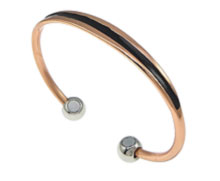 A copper bangle with two healing magnets