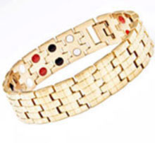 A gold Stainless Steel bracelet containing healing magnets